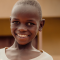 Smiling child from World Vision partnership community